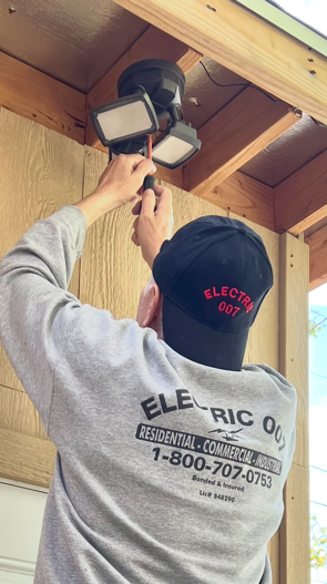 <img src="Electrician installing EV charger in Panorama City home.png" alt="Electrician installing EV charger in Panorama City home" />